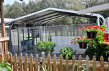 Puppy Kennel run protected from the weather with outdoor fans and a misting system