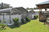 Puppy Kennel run protected from the weather with outdoor fans and a misting system